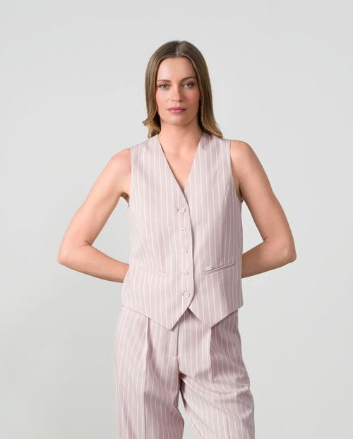 Fitted tailored gilet in ivory pinstripes with lurex thread on dusty pink background