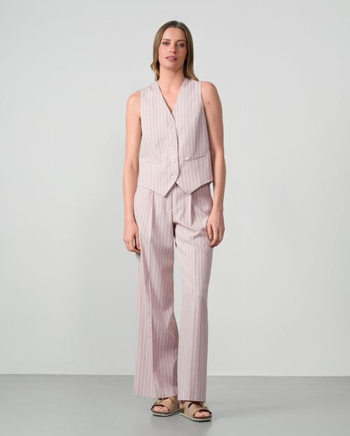 Fitted tailored gilet in ivory pinstripes with lurex thread on dusty pink background