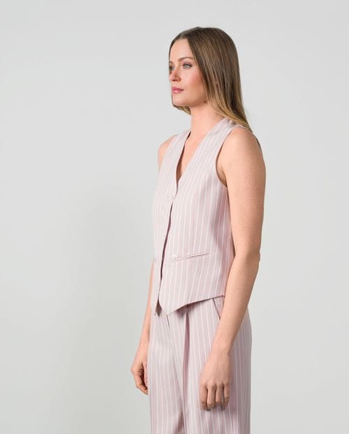 Fitted tailored gilet in ivory pinstripes with lurex thread on dusty pink background