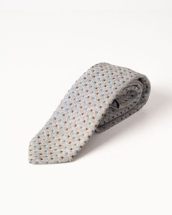 Tie with geometric check pattern