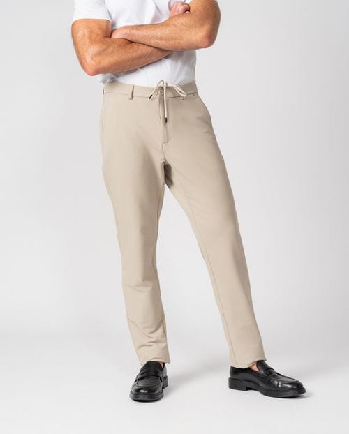Trousers with drawstring and elastic waistband, made of stretch technical fabric