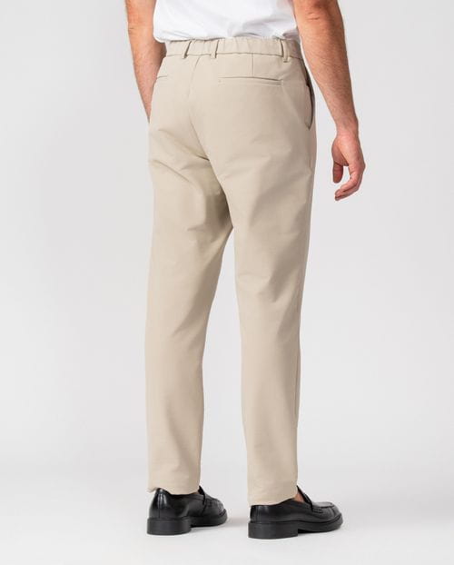 Trousers with drawstring and elastic waistband, made of stretch technical fabric