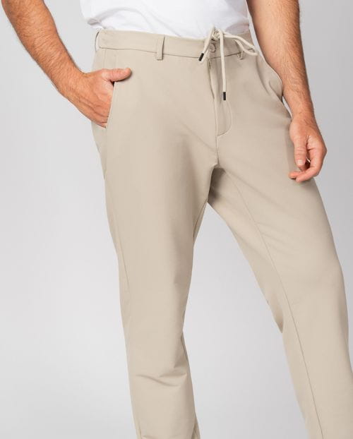 Trousers with drawstring and elastic waistband, made of stretch technical fabric