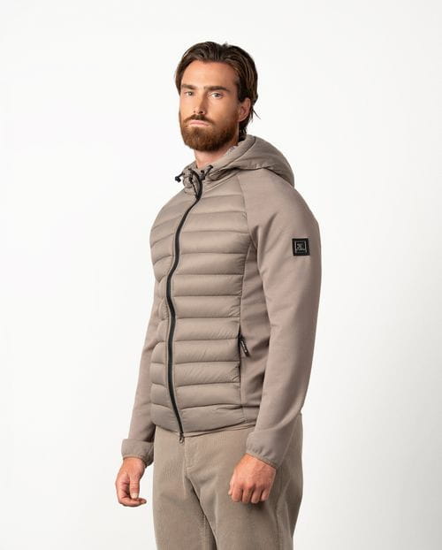 Ultra-light weight quilted hooded jacket combining technical fabric and foam