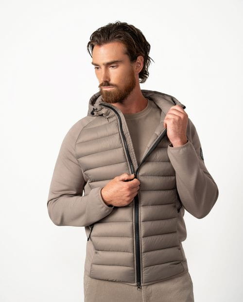 Ultra-light weight quilted hooded jacket combining technical fabric and foam