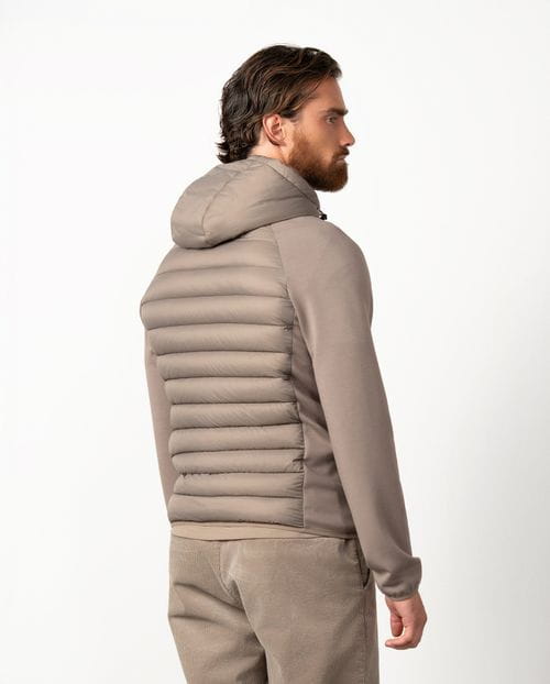 Ultra-light weight quilted hooded jacket combining technical fabric and foam