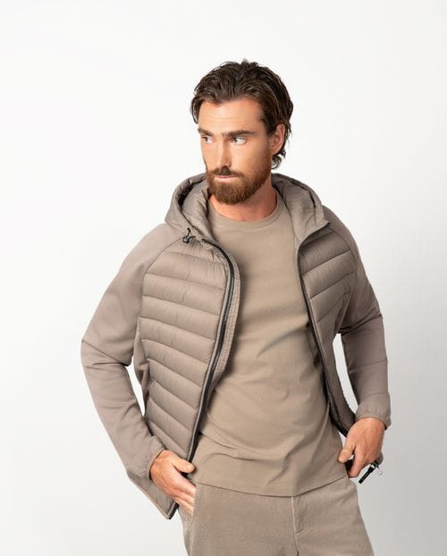 Ultra-light weight quilted hooded jacket combining technical fabric and foam