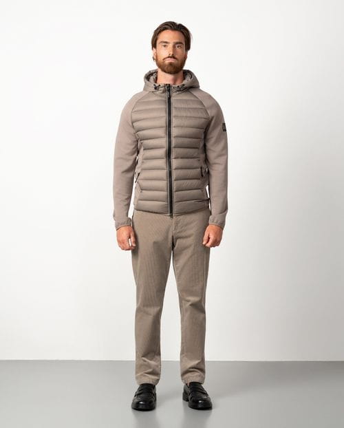 Ultra-light weight quilted hooded jacket combining technical fabric and foam