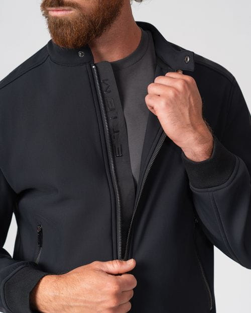 Black bomber jacket with stand collar in technical knit fabric
