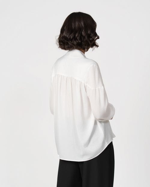 Romantic-style blouse with gathers and a tie neck detail in textured satin fabric