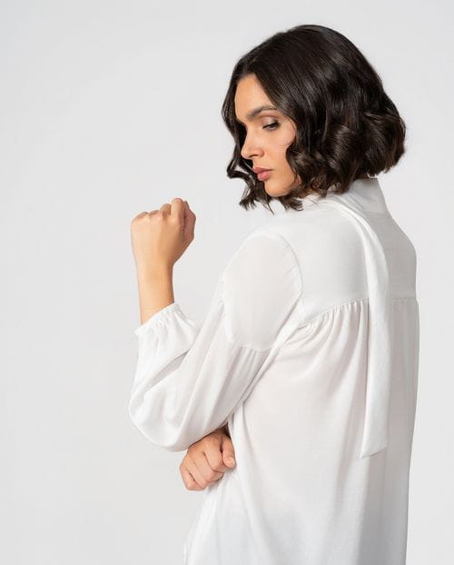 Romantic-style blouse with gathers and a tie neck detail in textured satin fabric