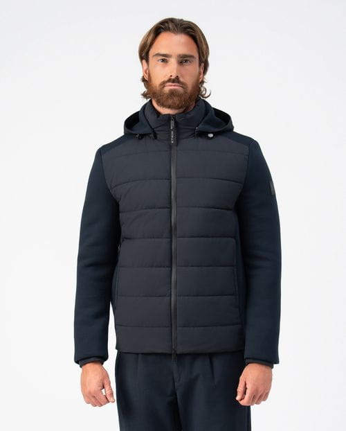 <p>Quilted jacket combining technical fabric and knit, with detachable hood</p>