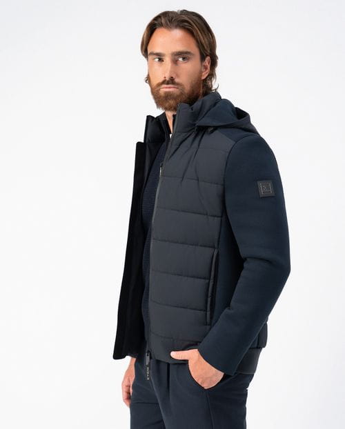 <p>Quilted jacket combining technical fabric and knit, with detachable hood</p>