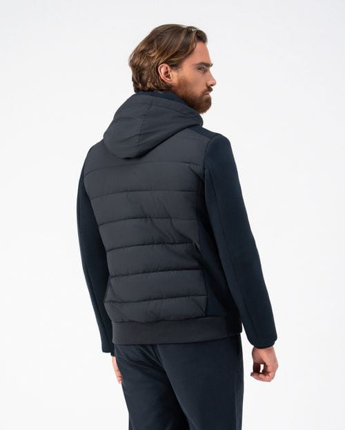 <p>Quilted jacket combining technical fabric and knit, with detachable hood</p>