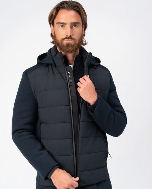 <p>Quilted jacket combining technical fabric and knit, with detachable hood</p>