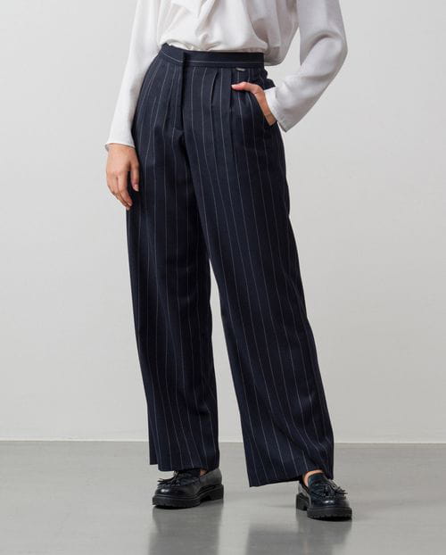 Wide leg pleated trousers made in wide chalk stripes fabric