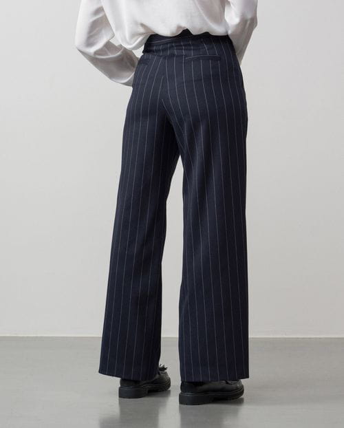 Wide leg pleated trousers made in wide chalk stripes fabric