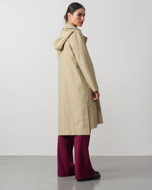 <p>Double-breasted hoodded garment in water-repellent fabric</p>