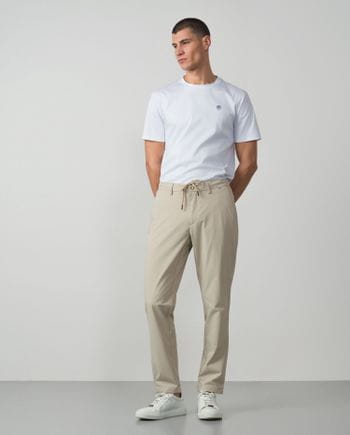Trousers with cord and elastic waistbrand made of flexible technical fabric