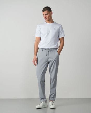 Trousers with cord and elastic waistbrand made of flexible technical fabric