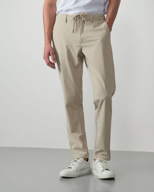 Trousers with cord and elastic waistbrand made of flexible technical fabric