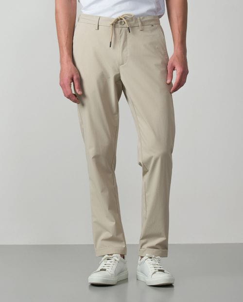 Trousers with cord and elastic waistbrand made of flexible technical fabric