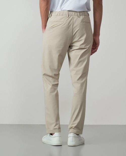 Trousers with cord and elastic waistbrand made of flexible technical fabric