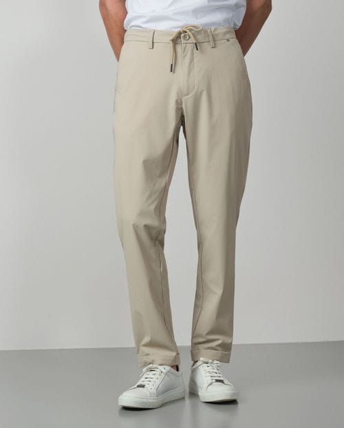 Trousers with cord and elastic waistbrand made of flexible technical fabric