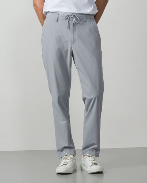 Trousers with cord and elastic waistbrand made of flexible technical fabric