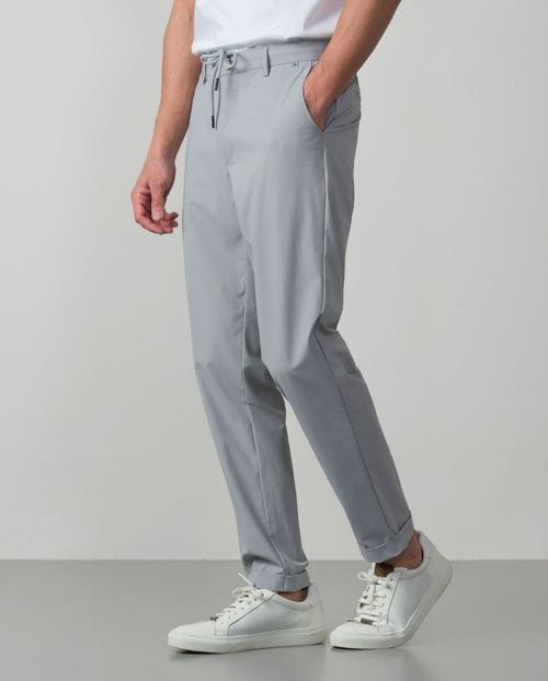 Trousers with cord and elastic waistbrand made of flexible technical fabric