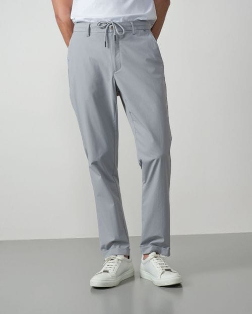 Trousers with cord and elastic waistbrand made of flexible technical fabric