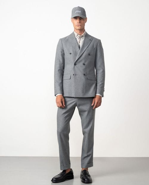 <p>Americana cruzada <em>slim fit desestructurada</em> en franela elástica de raya diplomática</p>