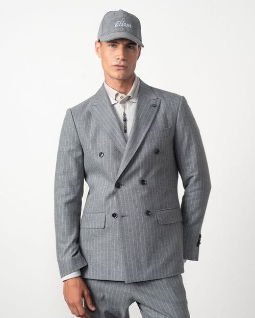 <p>Americana cruzada <em>slim fit desestructurada</em> en franela elástica de raya diplomática</p>