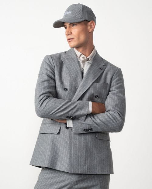 <p>Americana cruzada <em>slim fit desestructurada</em> en franela elástica de raya diplomática</p>