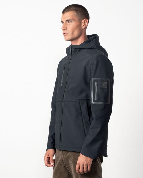 Hooded jacket made from a double knit and fleece fabric with many technical design details