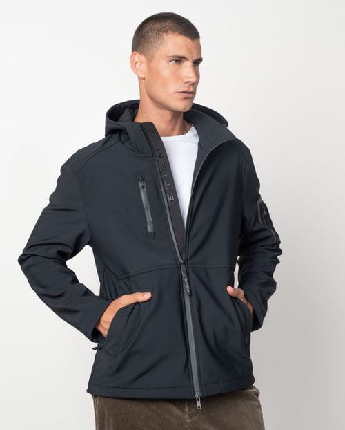 Hooded jacket made from a double knit and fleece fabric with many technical design details