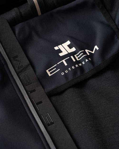 Hooded jacket made from a double knit and fleece fabric with many technical design details