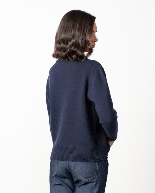 Wool sweater with a crew neck and gold buttons in front yokes