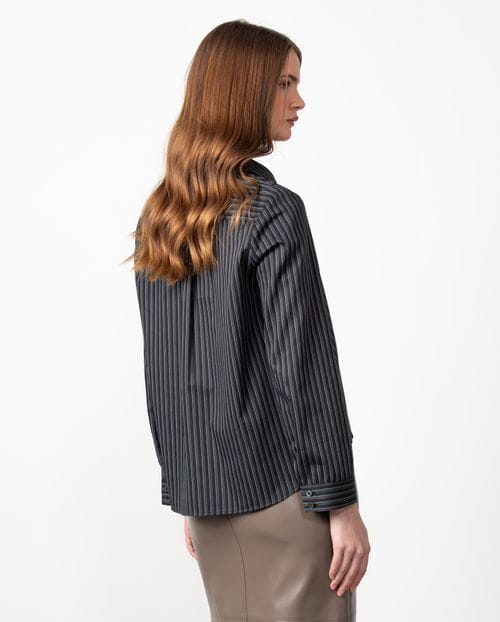A-line shirt with multi-stripes over a  black background