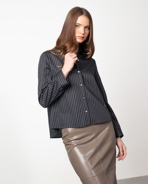 A-line shirt with multi-stripes over a  black background