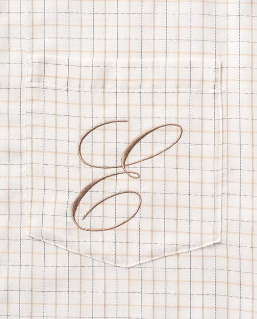 Blusón de línea suelta con bolsillo bordado, confeccionado en una sarga de cuadros ventana