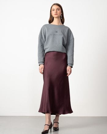 Midi skirt in satined fabric cut on the bias with personalized elastic band