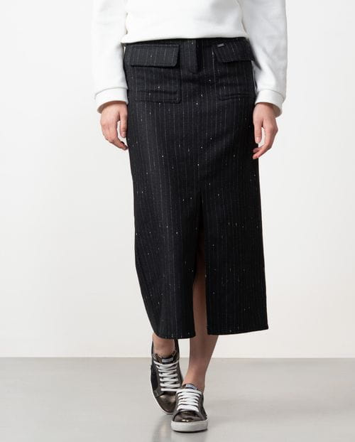 Straight midi skirt with patch pockets and front vent made from wool twill fabric with pintripe pattern