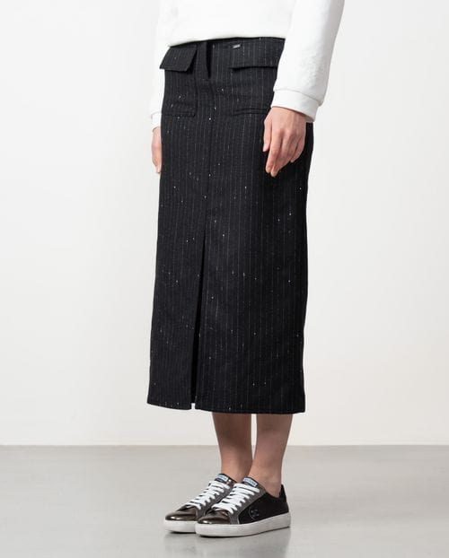 Straight midi skirt with patch pockets and front vent made from wool twill fabric with pintripe pattern