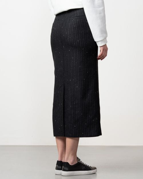 Straight midi skirt with patch pockets and front vent made from wool twill fabric with pintripe pattern