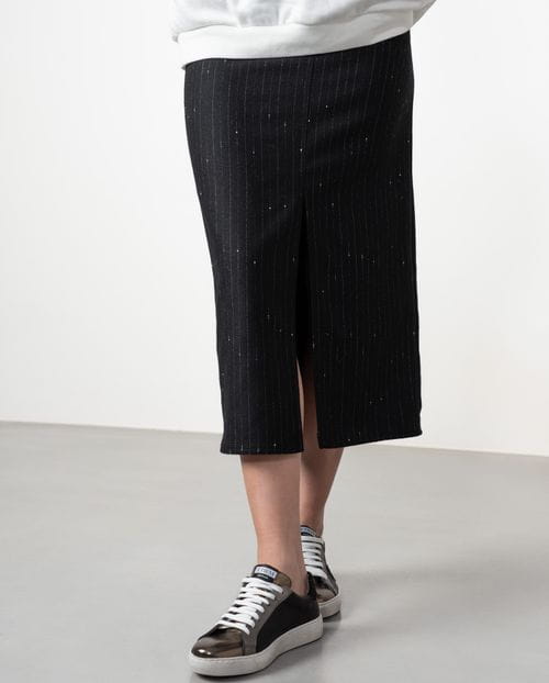 Straight midi skirt with patch pockets and front vent made from wool twill fabric with pintripe pattern