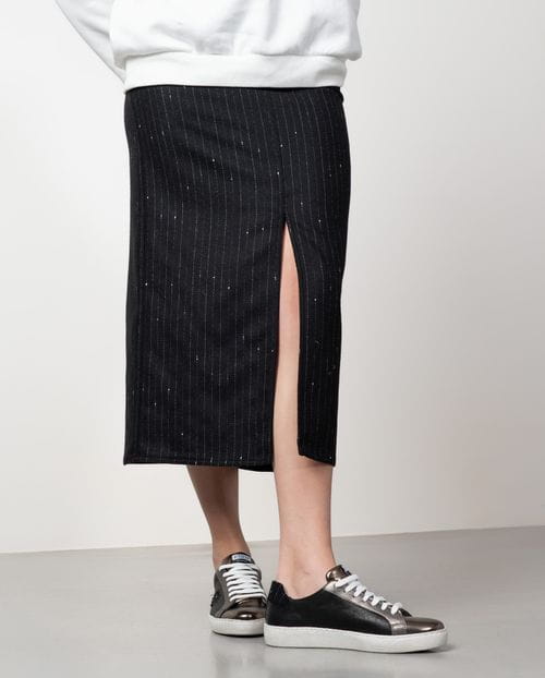 Straight midi skirt with patch pockets and front vent made from wool twill fabric with pintripe pattern