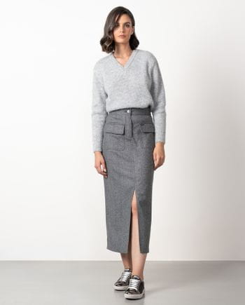 Straight midi skirt with patch pockets and front vent  made from cheviot wool fabric