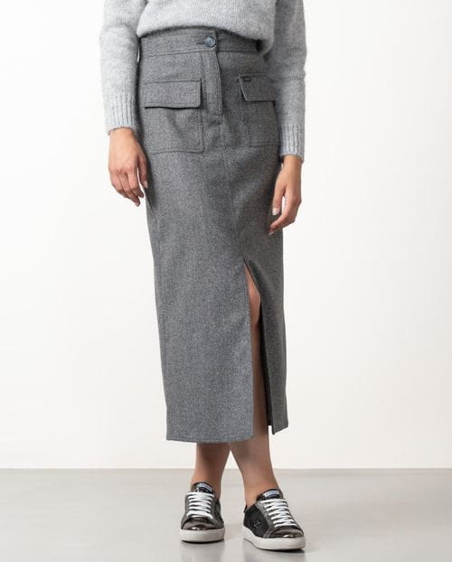 Straight midi skirt with patch pockets and front vent  made from cheviot wool fabric