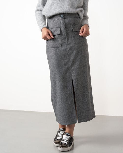 Straight midi skirt with patch pockets and front vent  made from cheviot wool fabric